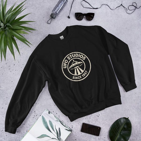 Black UFO Studios crewneck with distressed circular seal
